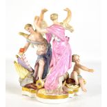 MEISSEN; a late 19th century porcelain figure group of dancers beside a putto, painted blue