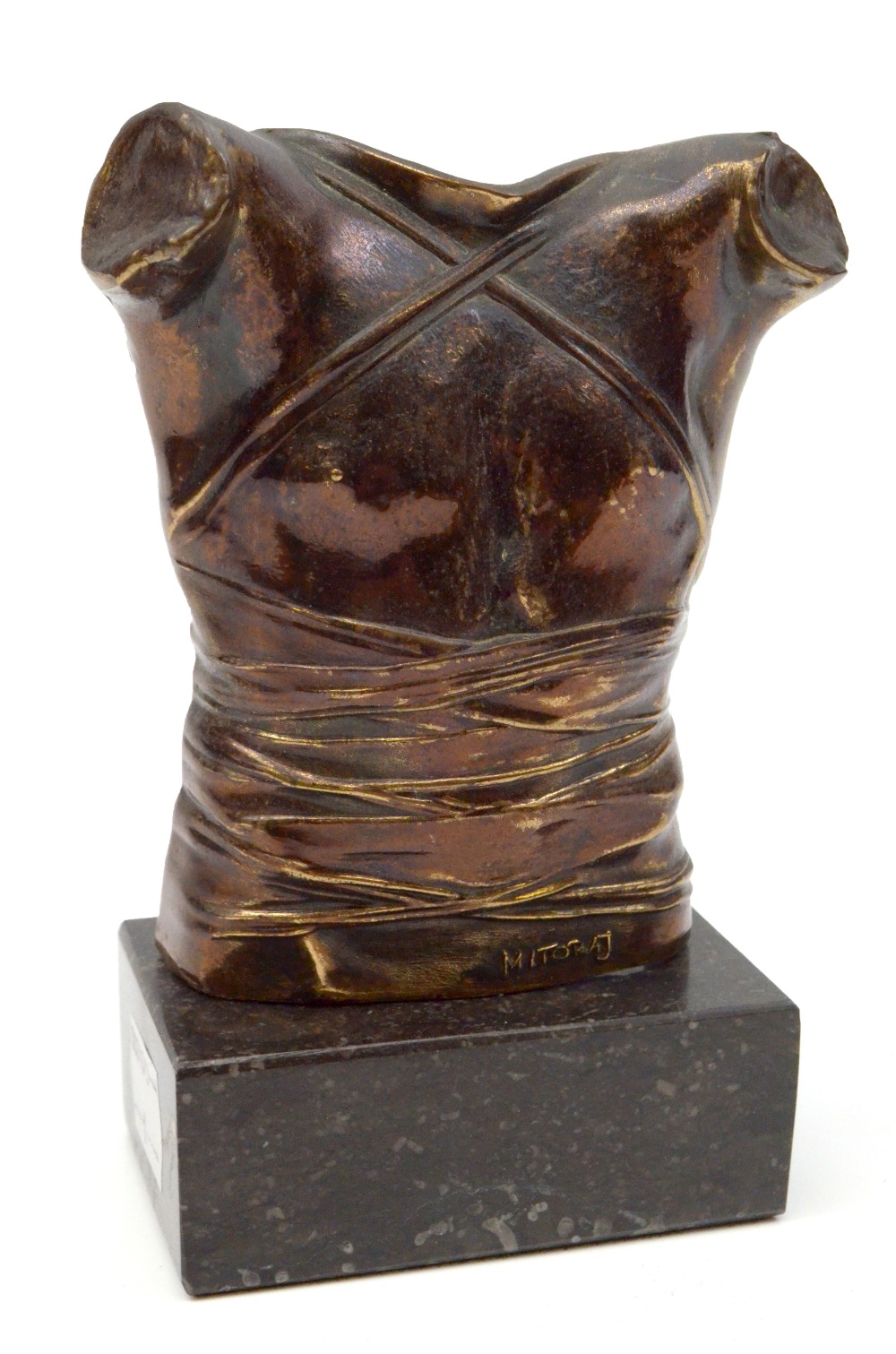 AFTER IGOR MITORAJ; a bronze torso sculpture, signed to lower section, on rectangular hardstone