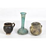A Roman turquoise iridescent glass bottle vase, height 16.3cm, a small Attic-style jug and a further