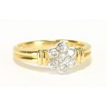 An 18ct yellow gold seven stone diamond floral cluster ring totalling approx 0.33cts, size M, approx