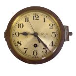 A WWII period Third Reich Kriegsmarine bulkhead clock, the dial set with Arabic numerals, numbered