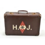 A German Third Reich Hitler youth suitcase with painted emblem and letters 'H.J.', scratched