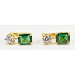 A pair of yellow metal earrings set with emerald cut green coloured stones and round cut white