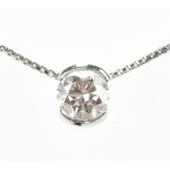 THEO FENNELL; an 18ct white gold and diamond necklace with single round brilliant cut stone weighing
