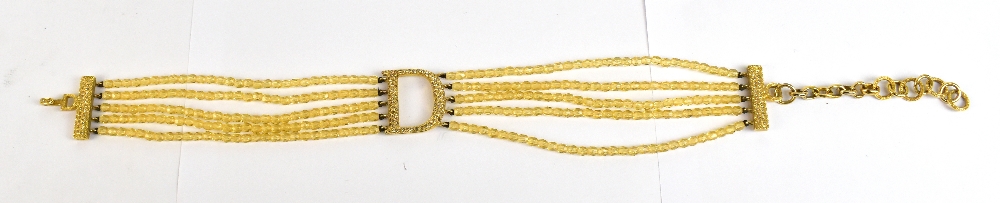 CHRISTIAN DIOR; a vintage gold toned 'D' and gold beaded choker, with a textured diamante clasp