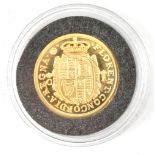 A yellow metal restrike/reproduction coin of King Charles I, laser engraved 497/5000, approx 4g.