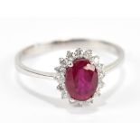 An 18ct white gold ruby and diamond floral set ring, size R, approx 2.7g, sold with receipt from