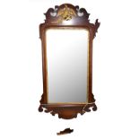 An Edwardian mahogany and inlaid fretwork wall mirror with gilt phoenix and further detail, with