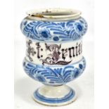 An 18th century English Delftware dry drug jar with floral upper and lower painted bands and with