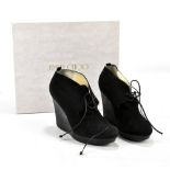 JIMMY CHOO, BAXTER; a pair of black suede women's black shoe/boot, with black lace ups, leather