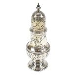 JABEZ DANIELL; a George II hallmarked silver sugar caster, with repoussé foliate decoration and