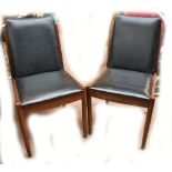 A pair of Danish teak dining chairs (2).