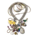 A quantity of costume jewellery including silver necklace, bangle, various chains, etc.