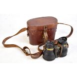 A pair of military issue binoculars stamped 'REF. number GE/338' in original case inscribed to