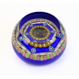 PERTHSHIRE; a porthole glass paperweight, signed and dated 1976 to cane, diameter 8.5cm.Additional
