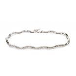 An 18ct white gold and diamond wave link line bracelet set with eighty-eight round brilliant cut