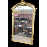 A good and large 19th century overmantel mirror with elaborate floral carved pierced arch top,