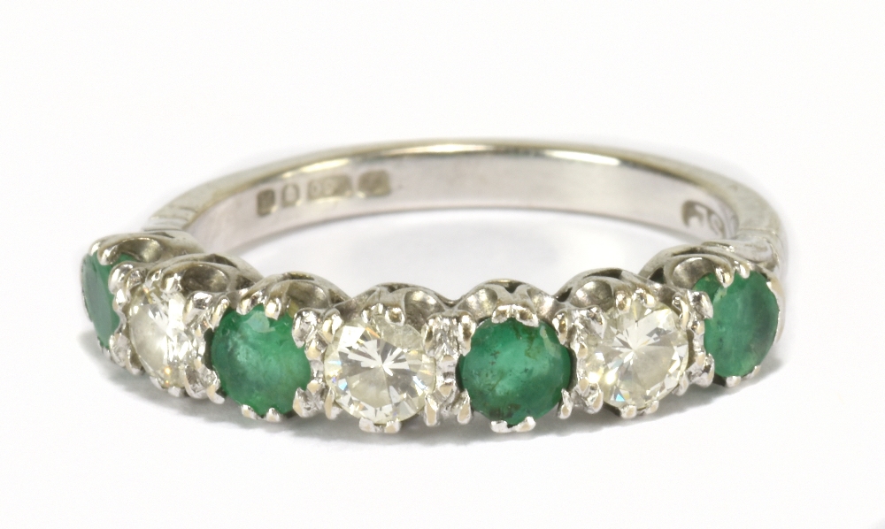 An 18ct white gold emerald and diamond seven stone ring, the three diamonds totalling approx 0.60ct,