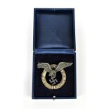 A WWII Third Reich Luftwaffe pilot badge, first 'round' type, unmarked, in blue box inscribed '