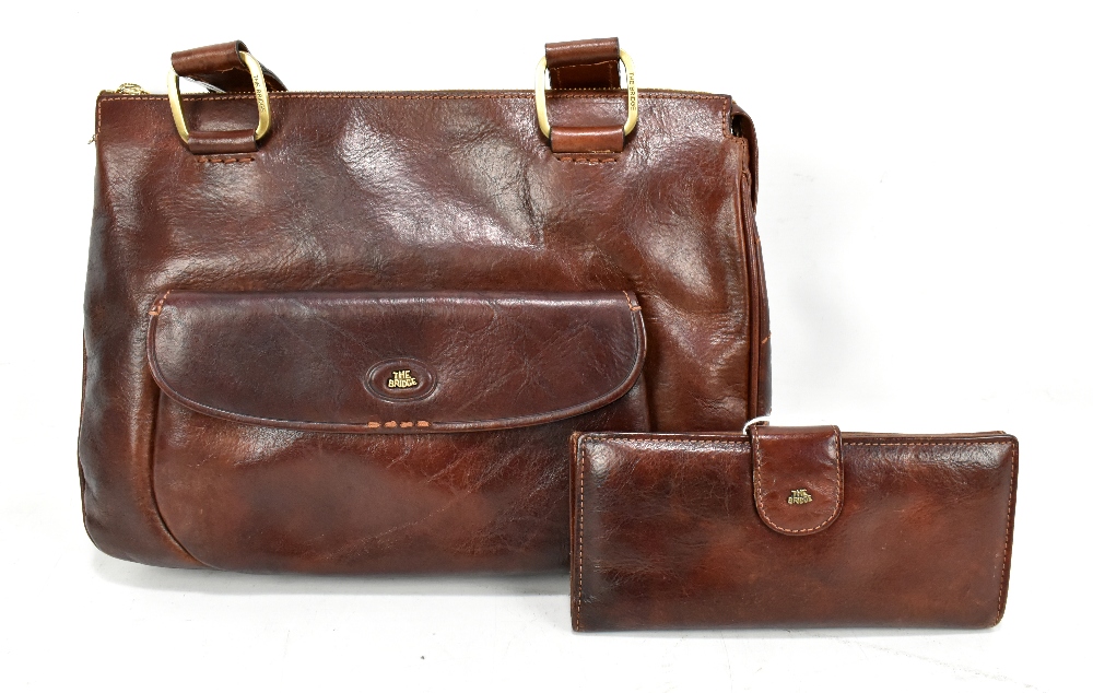 THE BRIDGE; a brown leather handbag with front pocket, 32 x 23 x 4 cm, with dust and The Bridge, a