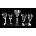 A group of predominantly 19th century drinking glasses comprising a pair with floral etched bowls