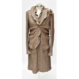 CHANEL; a vintage beige and cream tweed dress and jacket silk and wool suit, the geometric style