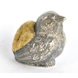 A late Victorian hallmarked silver pin cushion modelled as a chick, maker's and date marks obscured,