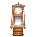 A late Victorian walnut, stained beech and inlaid wall clock with circular dial set with Roman