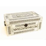 An early 19th century carved bone prisoner of war trinket box/casket, with pierced decoration, swing