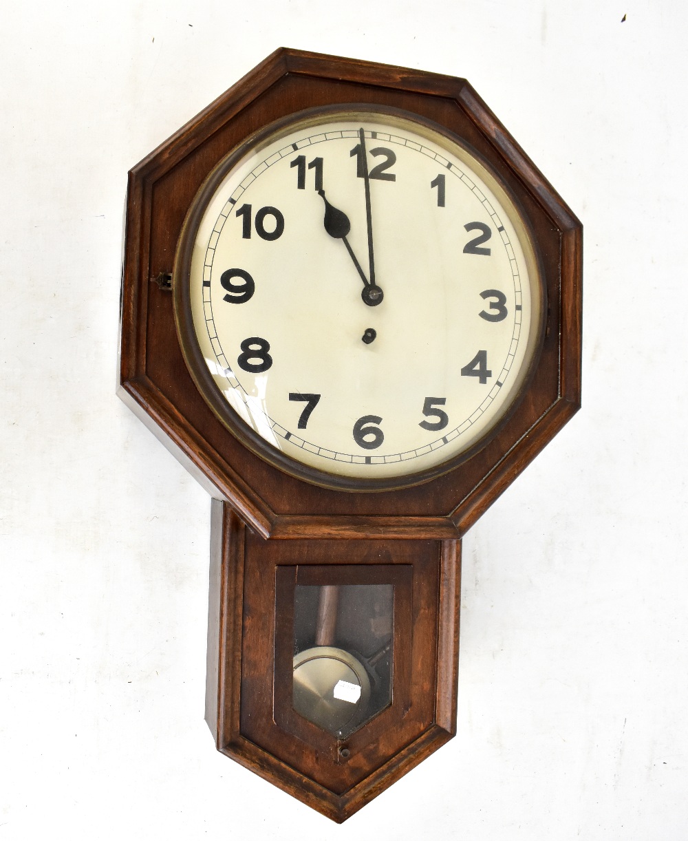 An early to mid-20th century American drop dial wall clock, the circular dial set with Arabic