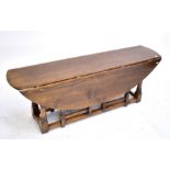 A reproduction oak coffee table.Additional InformationHeight 50.5cm, length 147cm.
