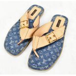 LOUIS VUITTON; a pair of lady's tan epi leather flip flops, with gold-tone buckle, and rubber soles,