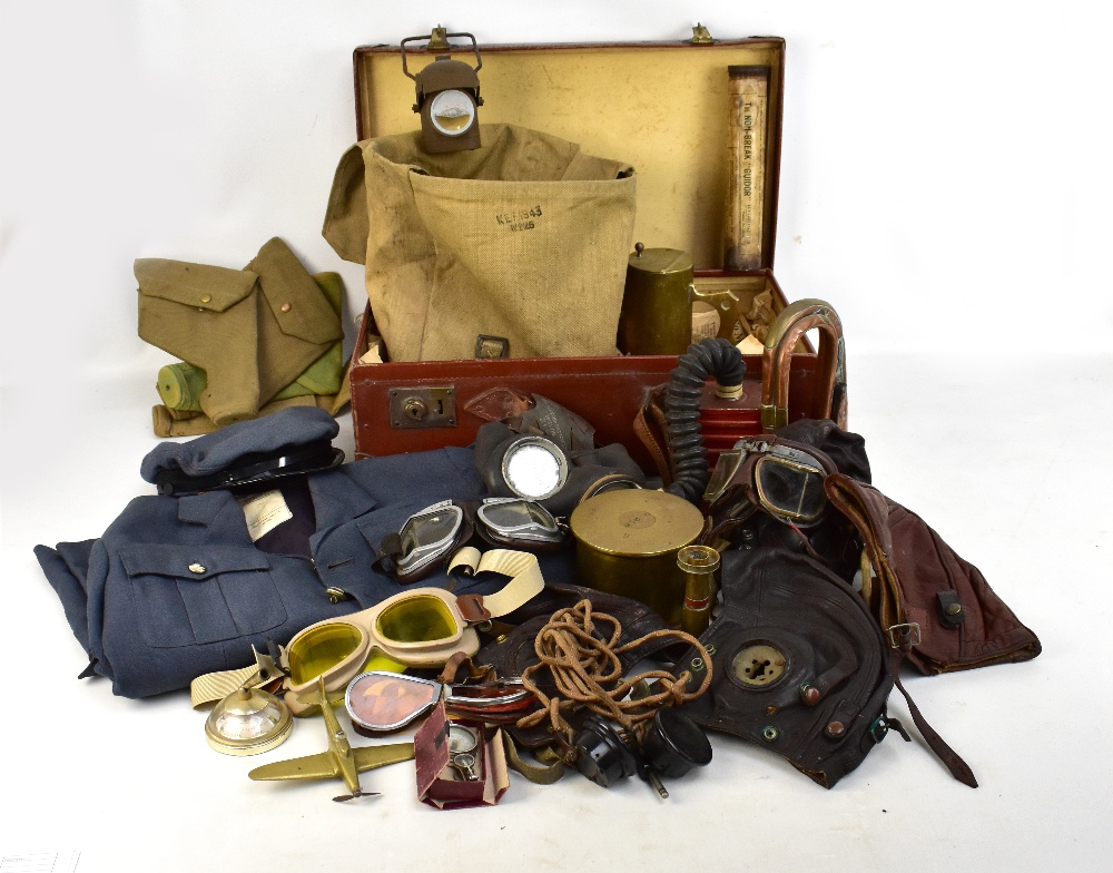 A group of military equipment and accessories including four leather flying helmets/caps, an RAF