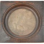 A WWI Memorial Plaque awarded to William Probert, inset in later oak frame.