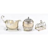 MAURICE FREEMAN; a Victorian hallmarked silver tea caddy with hinged lid and gadrooned detail,