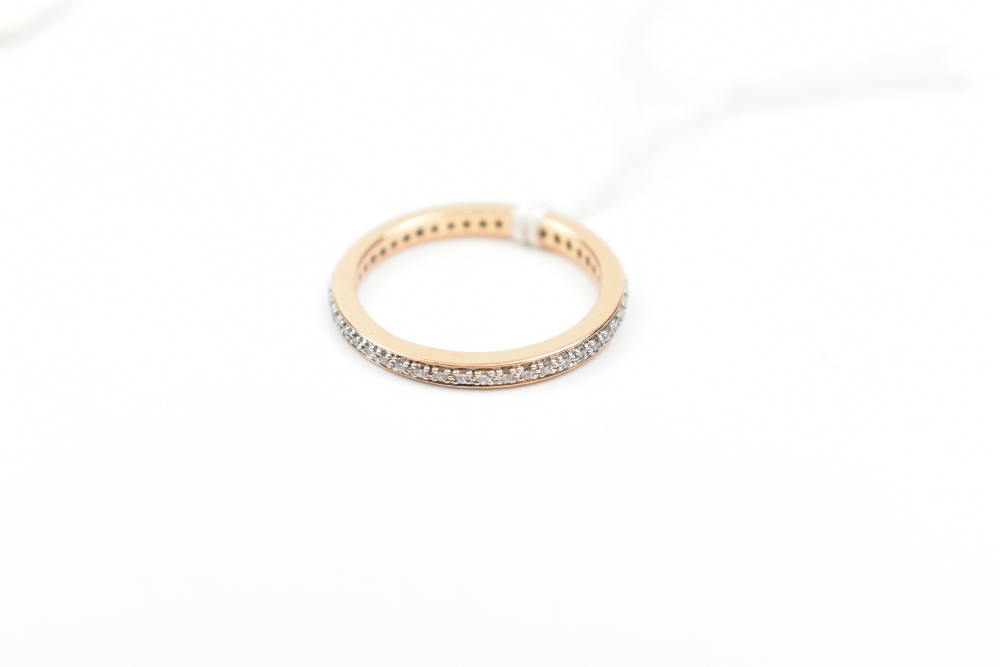 An 18ct yellow gold diamond full eternity ring, size K 1/2, approx 2.1g.