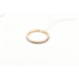 An 18ct yellow gold diamond full eternity ring, size K 1/2, approx 2.1g.