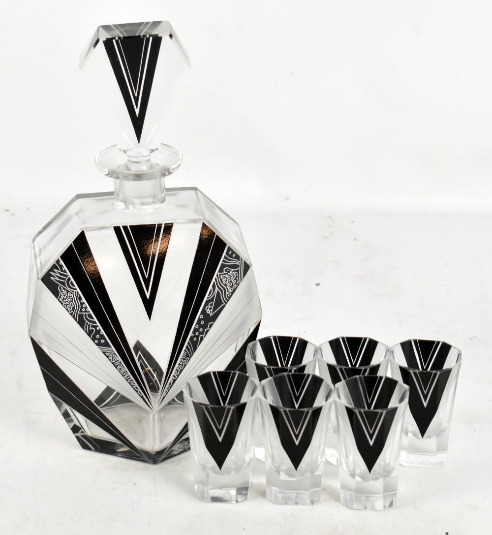An Art Deco glass seven piece drinking set, each with black and frosted geometric decoration, height
