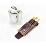 DAUM FRANCE; a crystal table lighter and a pen set containing the gold plated pens, one ink and