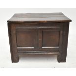 WITHDRAWN An early 18th century oak coffer of small proportions, a plank top above panelled front