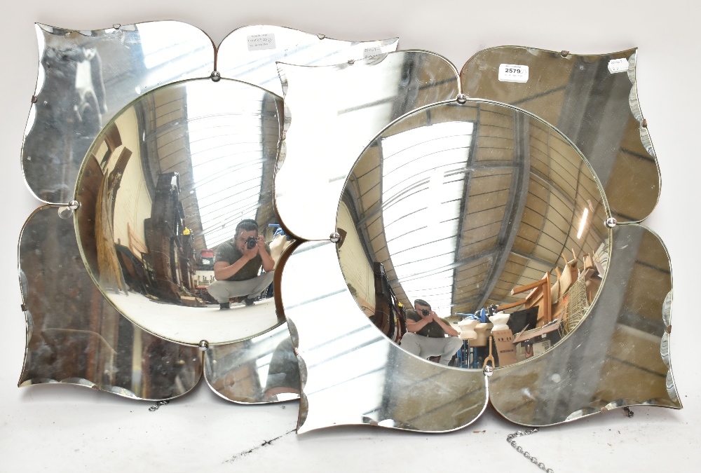 A pair of floral motif mirrors with convex centre panes, each approx 51 x 48.5cm (2).Additional