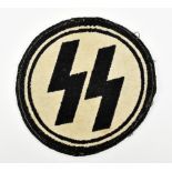 A German Third Reich SS sports cloth circular vest badge inscribed 'SS' on cream ground within black