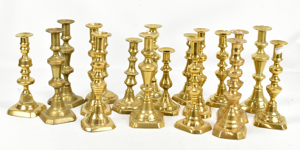 A group of brass candlesticks.