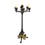 A good early 19th century bronze and ormolu mounted candelabrum, with seven sconces above well