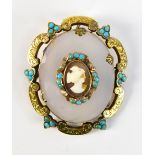 A Victorian pinchbeck and turquoise framed cameo brooch, the oval cameo on chalcedony backing,
