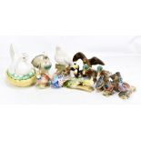 A group of bird figures including Beswick bullfinch, Jema pigeon, moulded peacock no.169 to base,
