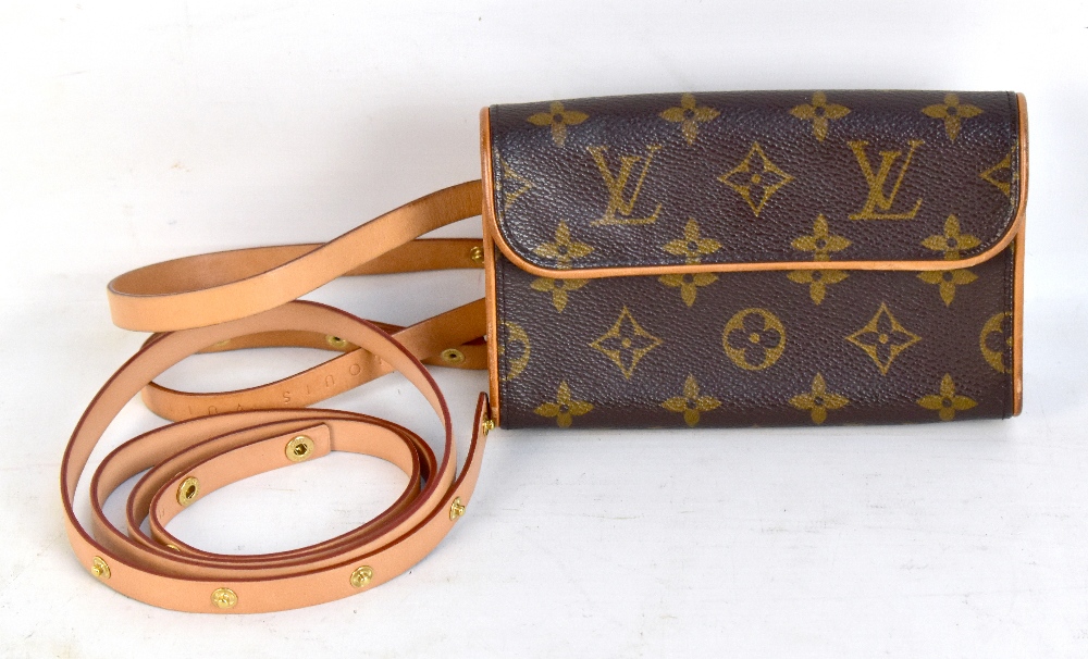 LOUIS VUITTON; a Monogram Florentine Pochette belt bag, with vachetta leather trim and gold toned