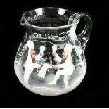 A late 19th century clear glass jug (possibly Sowerby), enamel decorated with two bearded impish