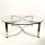 RICHARD YOUNG FOR MERROW ASSOCIATES; a circa 1970 glass topped coffee table raised on U-form