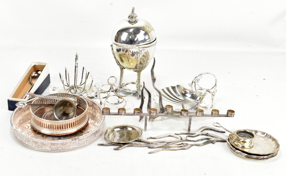 A mixed group of silver plated items including dishes, a toast rack, a bottle coaster.